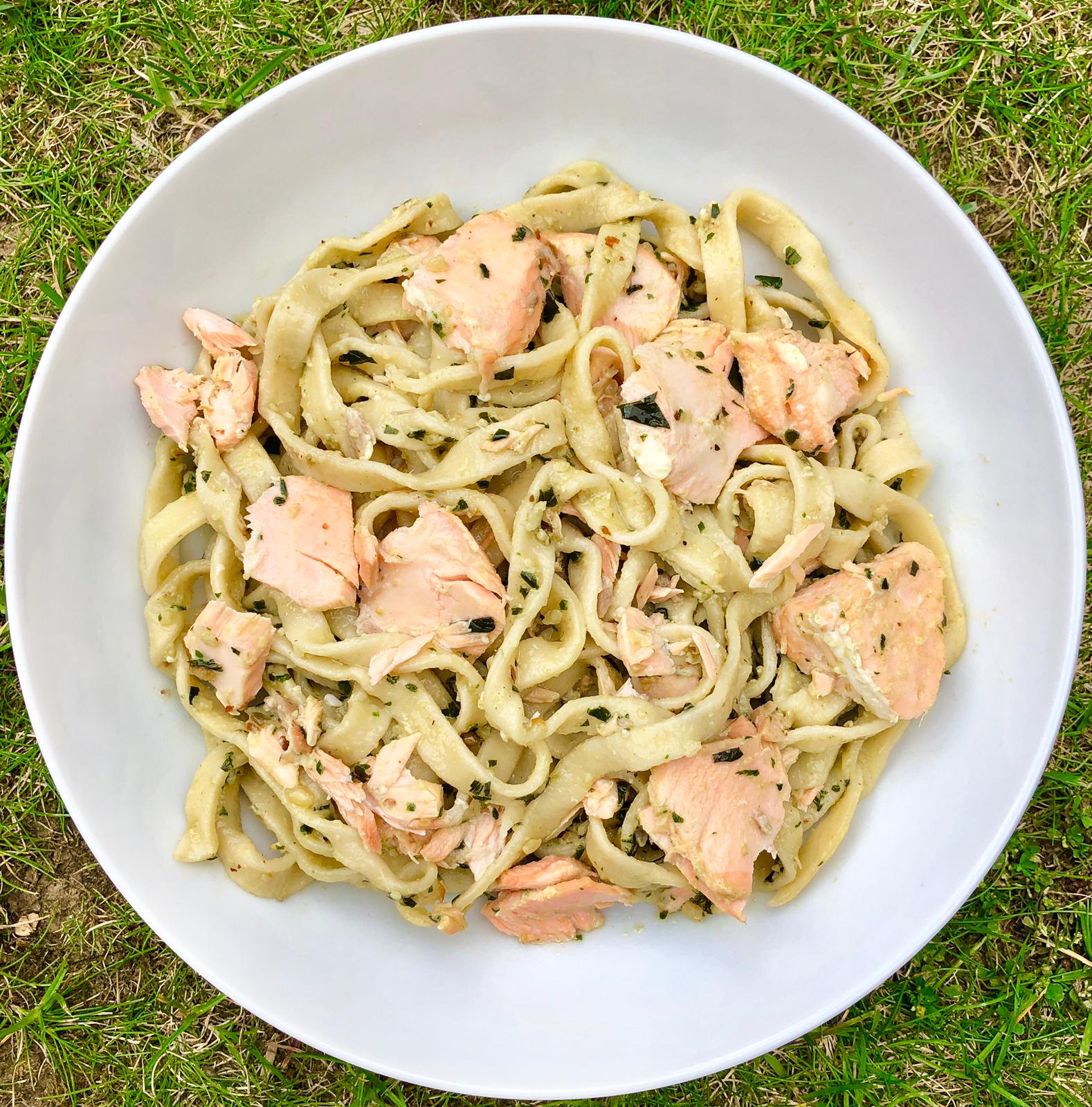 Bowl of nutty pesto salmon pasta