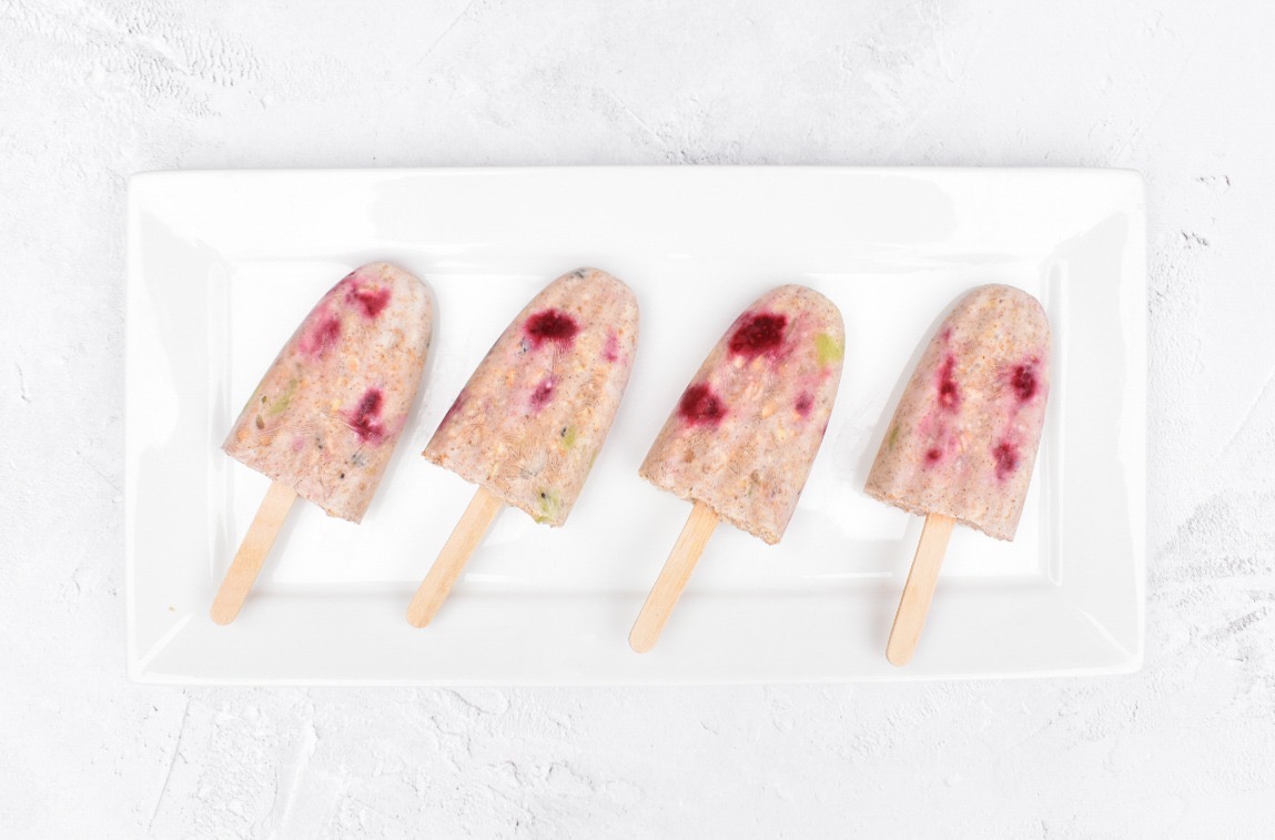 Fruity yoghurt lollipops served on a plate