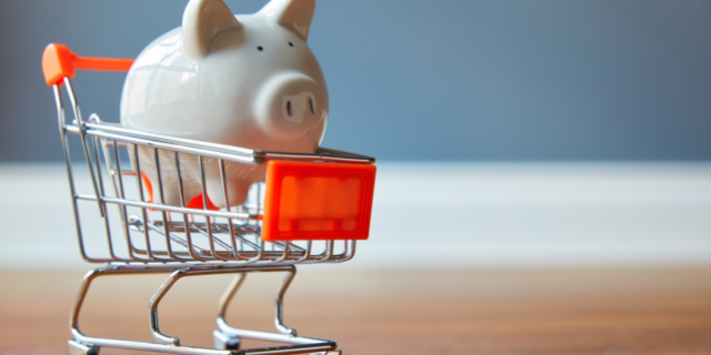 a piggy bank in a shopping trolley