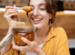 woman holding a honey jar