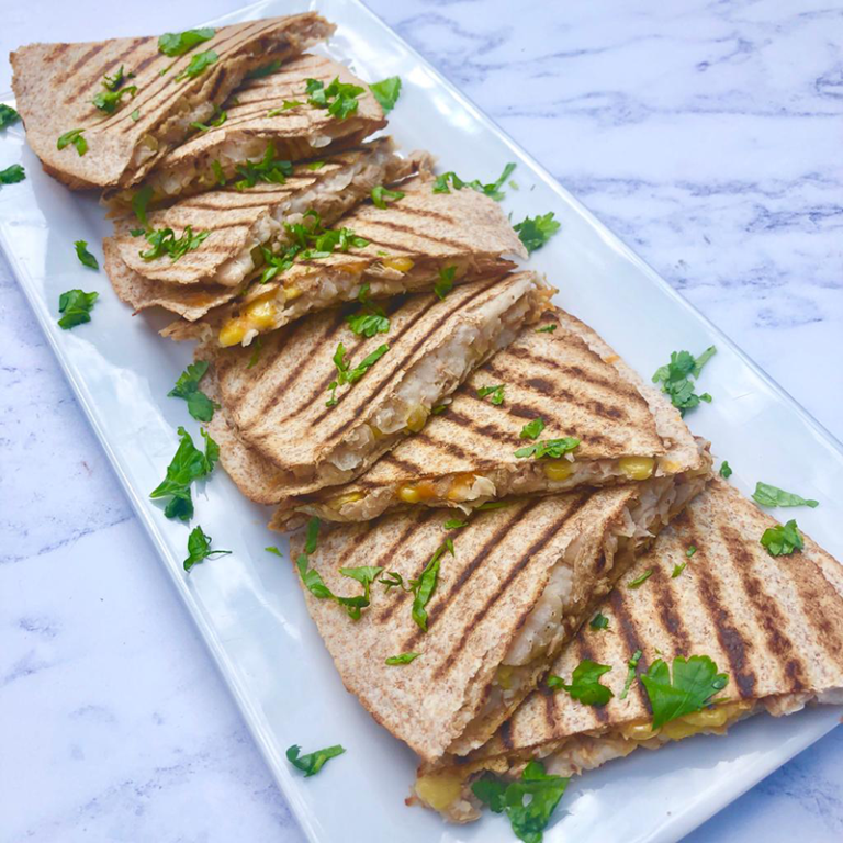 Platter of kids quesadillas topped with fresh parsley