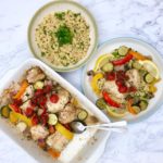 Overhead view of chicken and vegetable tray bake, a bowl of couscous with parsley, and a plated serving of the tray bake with couscous